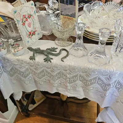 Assorted vintage glassware and collectibles, including Towle crystal candlesticks, cut-glass bowls, and a metal lizard figurine,...