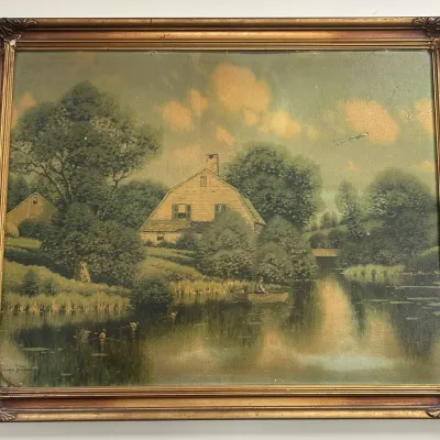 Sale Photo Thumbnail #150: Vintage landscape print by George W. Drew, depicting a rustic house by a river with a fisherman in a boat, housed in an ornate gilt frame.