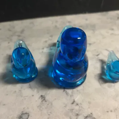 Sale Photo Thumbnail #54: Trio of vintage blue art glass bird figurines in graduated sizes, likely Leo Ward or Ron Ray style.