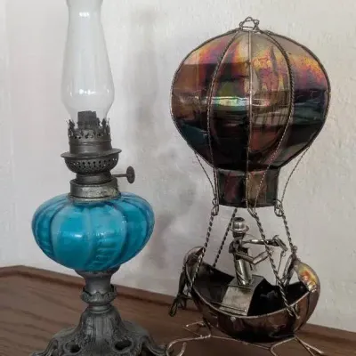 Pair of Vintage & Antique Tabletop Accents: Blue Glass Oil Lamp & Metal Hot Air Balloon Sculpture