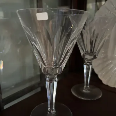 Pair of vintage crystal water goblets featuring a vertical cut pattern and a faceted stem.