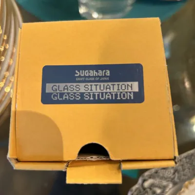 Sugahara Craft Glass of Japan "Glass Situation" item in its original yellow cardboard box.