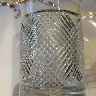 Vintage cut crystal double old fashioned glass featuring a diamond and wedge cut pattern with a thick, weighted base.