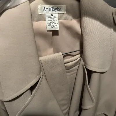 Vintage Ann Taylor beige wool trench coat, size 10, featuring a 100% wool shell and acetate lining, made in the USA.