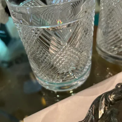 Vintage cut crystal lowball glasses featuring a detailed geometric diamond and crosshatch pattern.