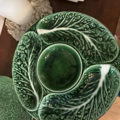 Vintage Bordallo Pinheiro green cabbage leaf majolica chip and dip platter, featuring a central well and textured leaf design.