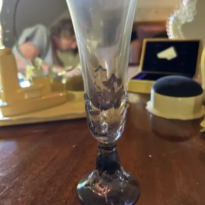 Vintage crystal champagne flute featuring a frosted bowl and a detailed, textured stem and base.