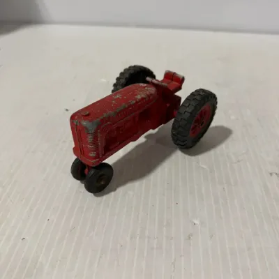 Sale Photo Thumbnail #317: Hubley Vintage Red Die-Cast Narrow Front Farm Tractor Toy Agricultural Collectible – Estate Sales Warehouse (GR)