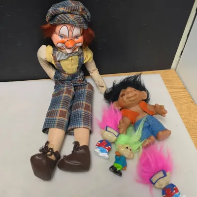 Large Clown Doll and Small Troll Dolls