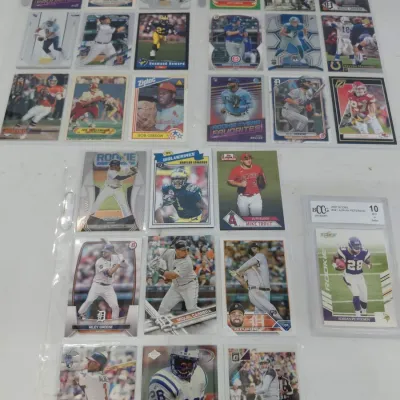27 Sports Cards in Protective Pages - Adrian Peterson RC Graded 10, Football & Baseball RCs
