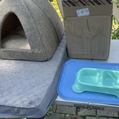 Pet Care Supplies Lot with Dome Cave Bed, Dual Bowl, and Grooming Accessories - Grand Rapids Off-Site