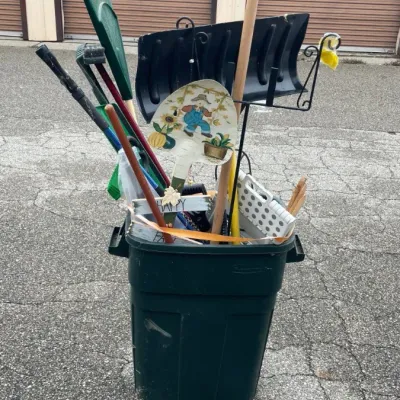 Sale Photo Thumbnail #248: Rubbermaid 30 Gallon Waste Bin Containing Assorted Yard Tools & Decor
