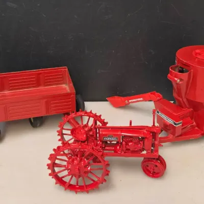 3 Piece Collection of 1/16 Scale Farmall Die Cast Tractor and 2 Implements