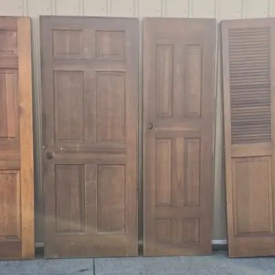(3) Wood Doors and (2) Bifold Doors with Hardware