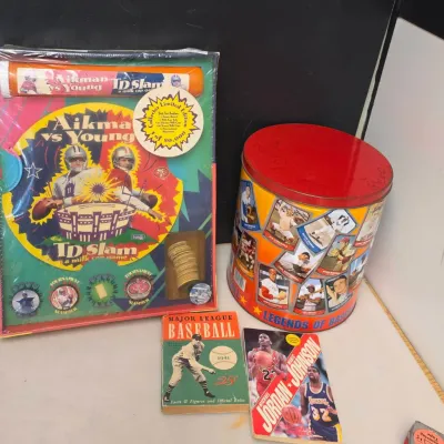 Sports Memorabilia Collectible Tin, Pog Set, and 2 Books