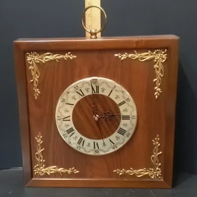 Mid Century Square Wooden Wall Clock Featuring A White Roman Numeral Dial And Gold Corner Accents – Potterville