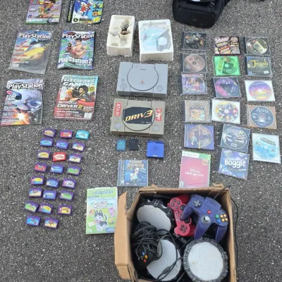 Collection of Vintage Video Game Items - Sony PlayStation 1 Console, Controllers, Strategy Guides