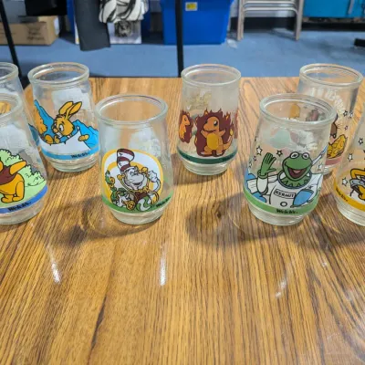 Welch's Lot Of Collectible Jars: 3 Pooh, 3 Muppets, 1 Pokemon, & 1 Dr. Seuss - Estate Sales Warehouse (GR)