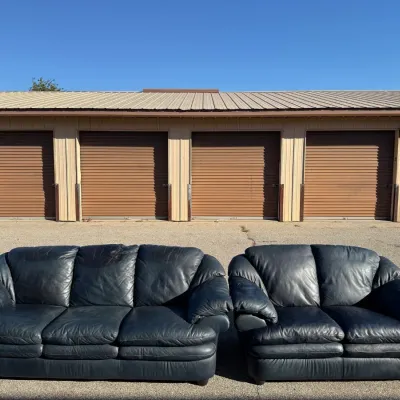 Pair of a Black Leather Couch and Love Seat
