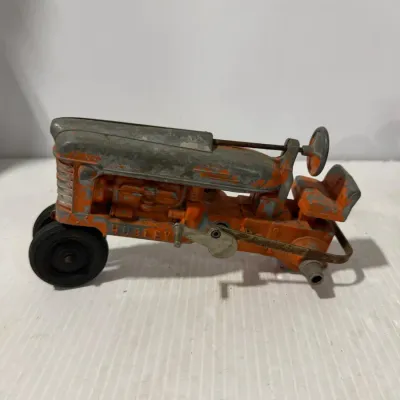 Sale Photo Thumbnail #319: Hubley Cast Metal Orange & Gray Farm Tractor Toy – Estate Sales Warehouse (GR)