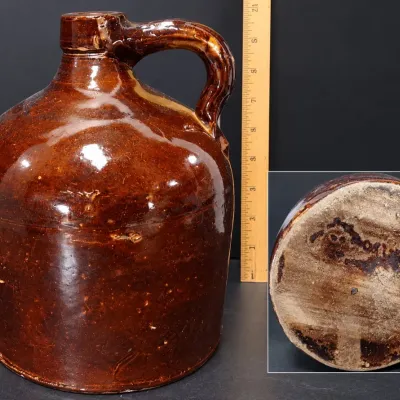 Sale Photo Thumbnail #304: Antique Brown Glazed Stoneware Whiskey / Molasses Jug - Handled Primitive Crock – Potterville