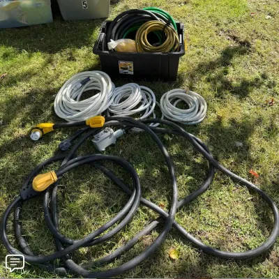 Large Lot of Heavy-Duty Power Cords, Water Hoses, Utility Hoses & Storage Tote - Howard City Off-Site