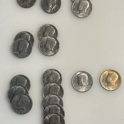 Lot of 20 - Early Date AU / BU Kennedy Half Dollars