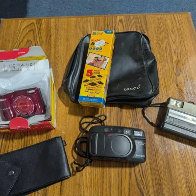 Vintage To Digital Camera Lot: Kodak Tele Disc, Minolta Sightseer, & Nikon Coolpix With Extra Film - Estate Sales Warehouse (GR)