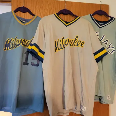 Sale Photo Thumbnail #106: Three vintage MLB pullover jerseys, including two Milwaukee Brewers jerseys and one Toronto Blue Jays jersey, circa 1980s.
