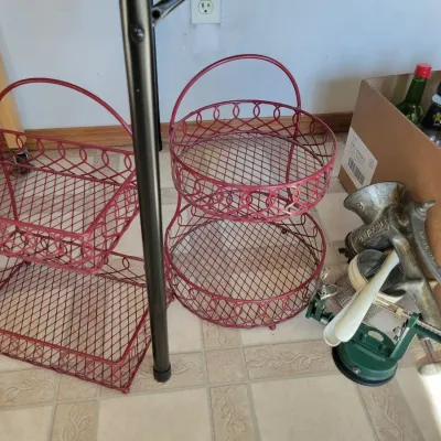 Sale Photo Thumbnail #67: Red wire-mesh tiered storage baskets.