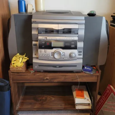 Sale Photo Thumbnail #76: GPX shelf stereo system with dual cassette decks, CD player, record player matching speakers, and roll cart