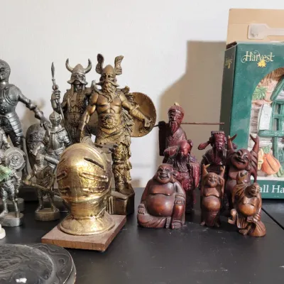 Sale Photo Thumbnail #25: decorative medieval knights, Viking warriors, and wooden Buddha statues.
