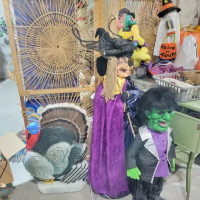 Sale Photo Thumbnail #148: Assorted vintage Halloween and Thanksgiving decorations, including a blow-mold turkey, standing witch and Frankenstein figure and a woven wicker room divider.