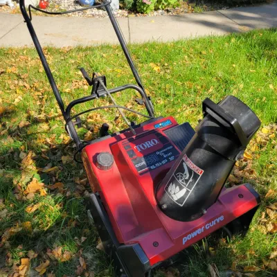 Sale Photo Thumbnail #228: Toro CCR 3650 Power Curve snowblower, featuring a 6.5 HP engine, 20-inch clearing width, and electric start capability.
