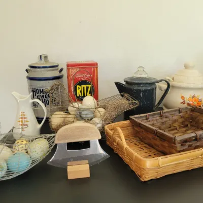 Sale Photo Thumbnail #66: wire chicken egg baskets, woven trays, Ritz tin, a ceramic pitcher, and enamel coffee pot.