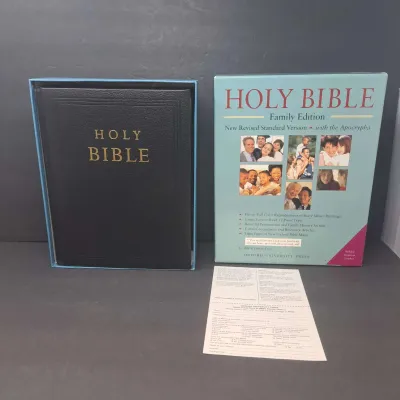Oxford University Press Holy Bible Family Edition, New Revised Standard Version with the Apocrypha, featuring a black padded imitation...