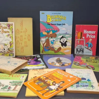 Collection of vintage children's books, including titles like "Charlotte's Web," "Amelia Bedelia," and a...