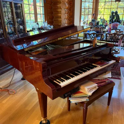 Sale Photo Thumbnail #10: Schimmel grand piano in a polished mahogany finish, complete with a matching bench and sheet music.  Just Pristine