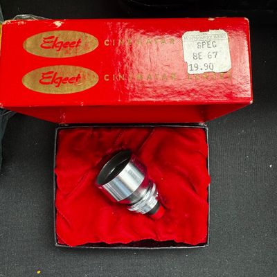 Sale Photo Thumbnail #71: Vintage Elgeet Cinematar lens in its original red presentation box with a velvet-lined interior and a Montgomery Ward price tag.