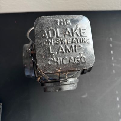 Sale Photo Thumbnail #15: Vintage Adlake non-sweating railroad lamp, featuring embossed lettering on the top cap, manufactured in Chicago.