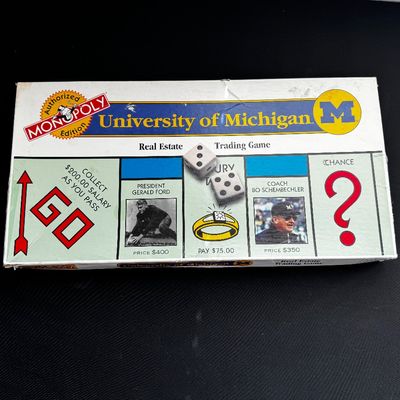 Sale Photo Thumbnail #28: Vintage University of Michigan Monopoly board game in its original box, featuring themed spaces like President Gerald Ford and Coach Bo Schembechler.