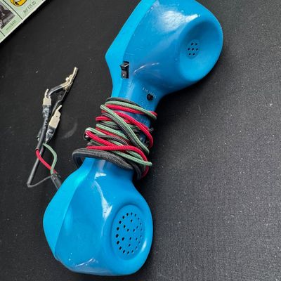 Sale Photo Thumbnail #41: Vintage blue Harris Dracon TS22 telephone test set, commonly known as a butt set, with wrapped cord and alligator clips.