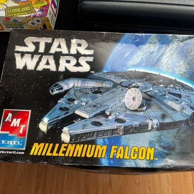 Vintage AMT Ertl Star Wars Millennium Falcon model kit in its original box, showing some shelf wear on the corners.