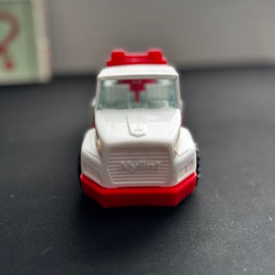 Sale Photo Thumbnail #36: Vintage Nylint toy tow truck in white and red plastic, showing some light wear from play.