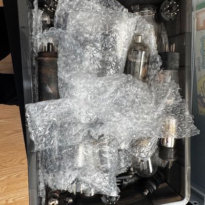 Sale Photo Thumbnail #60: Collection of vintage vacuum tubes of various sizes, stored with bubble wrap in a plastic bin.