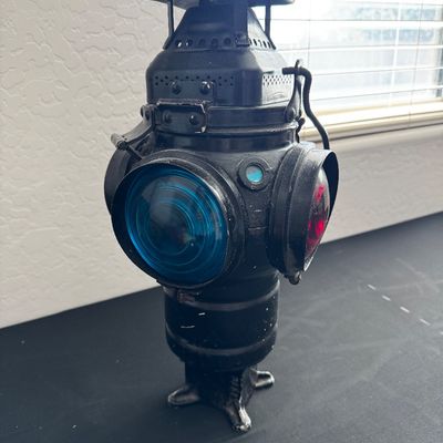 Sale Photo Thumbnail #17: Vintage railroad switch lantern in black painted metal, featuring blue and red glass lenses.