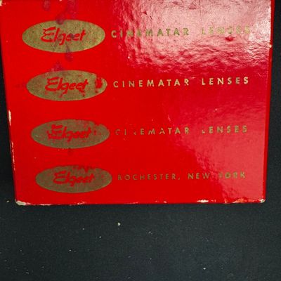 Sale Photo Thumbnail #72: Vintage red Elgeet Cinamatar Lenses box from Rochester, New York, showing some wear on the edges and surface.