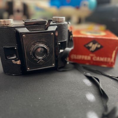 Sale Photo Thumbnail #70: Vintage Agfa PD16 Clipper folding camera with its original red cardboard box, circa late 1930s to 1940s.