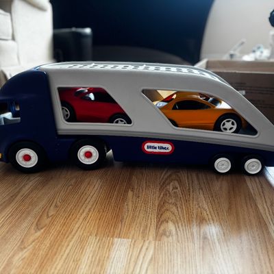 Sale Photo Thumbnail #50: Little Tikes toy car carrier truck in blue and grey, complete with red and yellow sports cars.