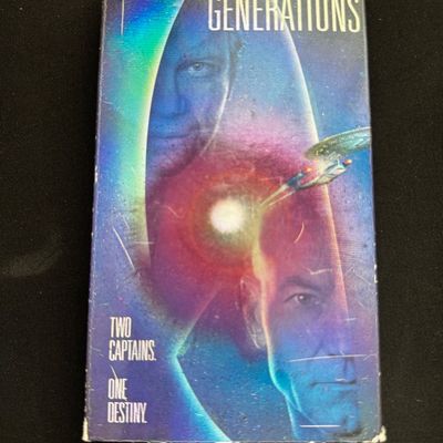 Sale Photo Thumbnail #23: Star Trek Generations VHS tape in its original cardboard sleeve, showing some light wear along the edges.